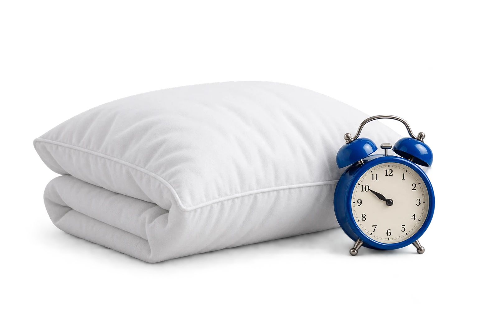Almohada y reloj para preparar una rutina de descanso